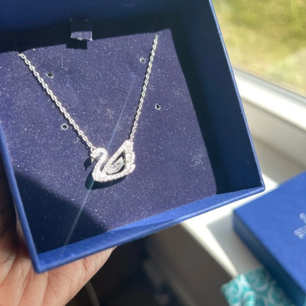 - Swan necklace white rhodium plated from swarovski